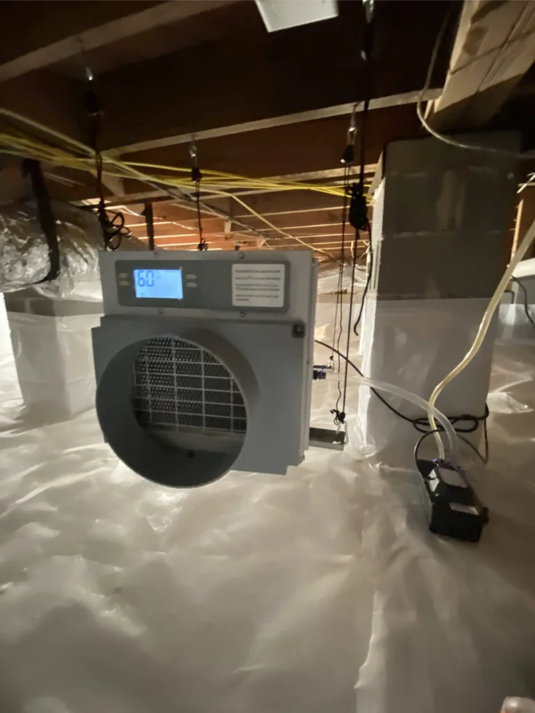 operating dehumidifier installed inside the encapsulated crawl space